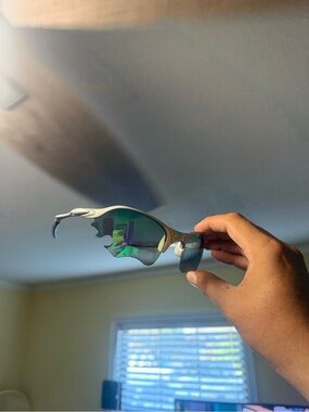Oakley Silver Frame with Green Mirrored Lens Sports Sunglasses